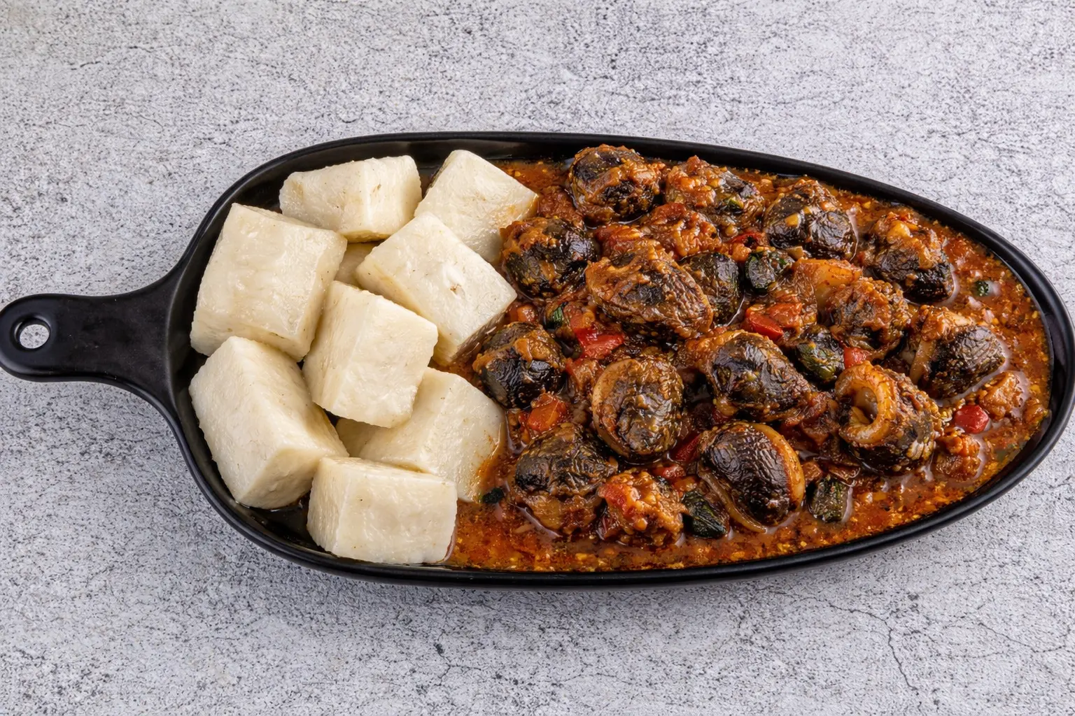 Snails with Yam at The Tantalizers African House in Edmonton, AB